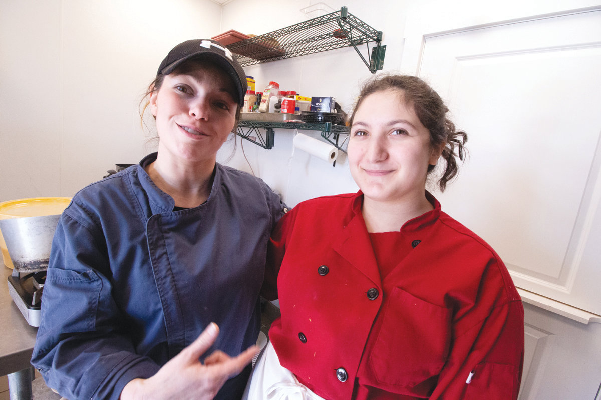 TIGHT QUARTERS: Chef Mel and student Kelsie Tridento worked the tiny club kitchen. (Herald photos)